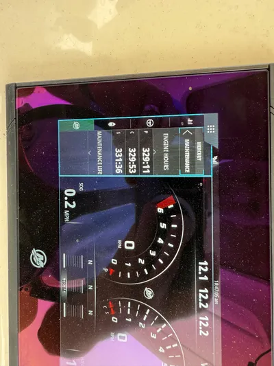  Yacht Photos Pics Dashboard display of a 2020 Scout 355 LXF boat showing engine hours and speed.