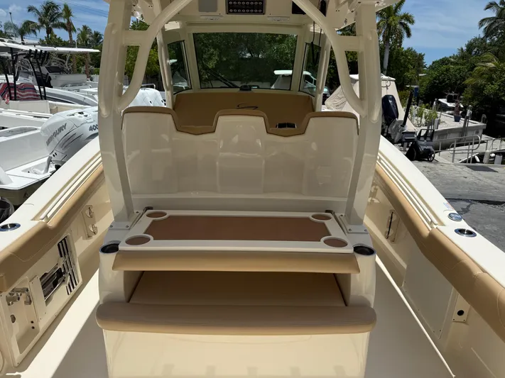  Yacht Photos Pics 2020 Scout 355 LXF boat interior with seating and cup holders.