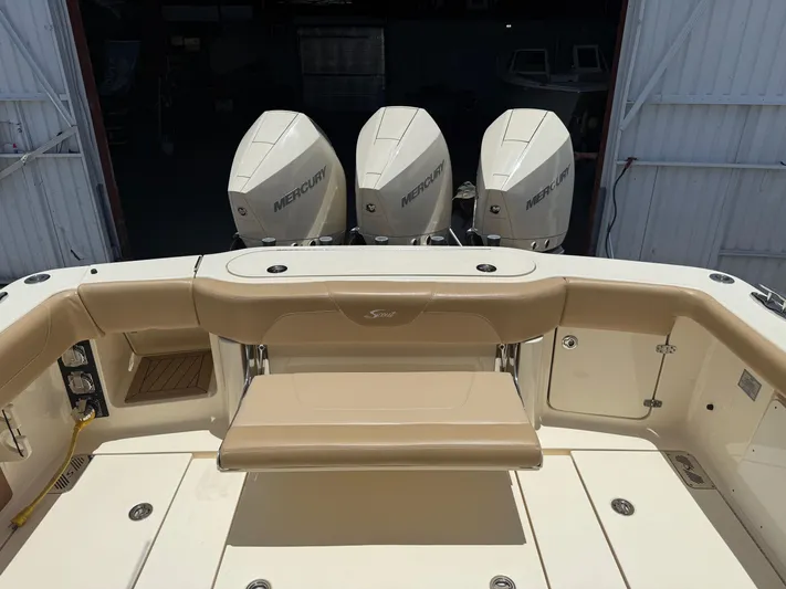  Yacht Photos Pics 2020 Scout 355 LXF boat with triple Mercury engines, beige seating, and spacious deck.