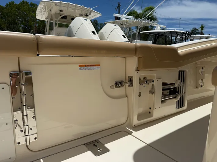  Yacht Photos Pics 2020 Scout 355 LXF boat interior with beige seating and stainless steel hardware.