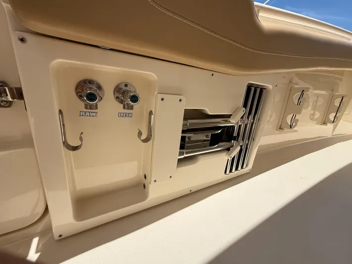  Yacht Photos Pics 2020 Scout 355 LXF boat interior with water outlets and storage compartments.