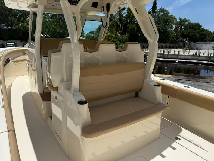  Yacht Photos Pics 2020 Scout 355 LXF boat interior with beige seating and sleek design.