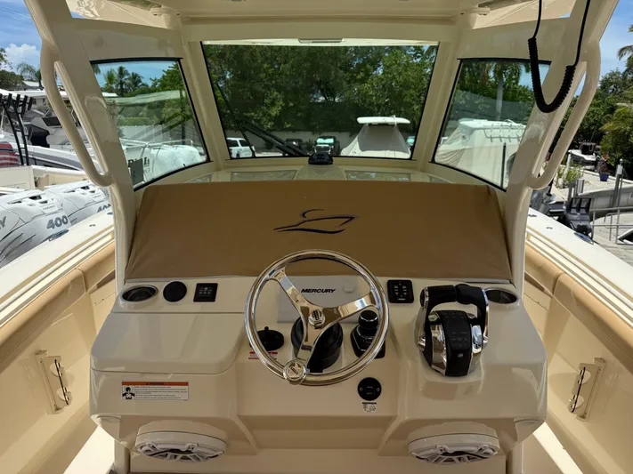  Yacht Photos Pics 2020 Scout 355 LXF boat helm with Mercury controls and steering wheel.