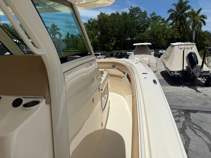  Yacht Photos Pics 2020 Scout 355 LXF boat docked, showcasing sleek design and luxurious features.