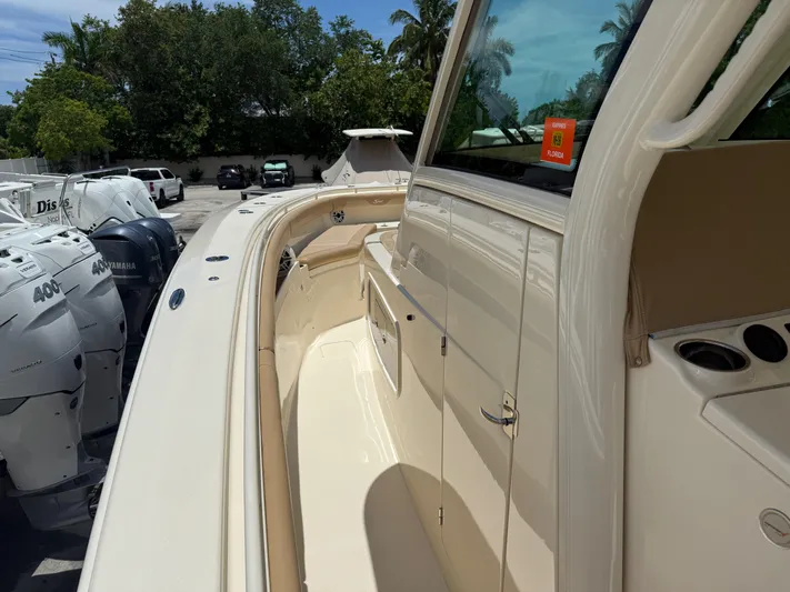  Yacht Photos Pics 2020 Scout 355 LXF boat with Yamaha engines, docked outdoors.