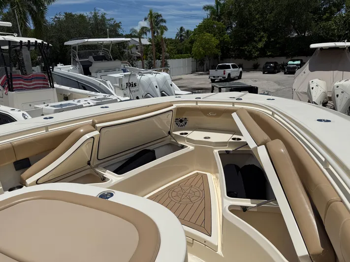  Yacht Photos Pics 2020 Scout 355 LXF boat interior with luxurious seating and storage compartments.