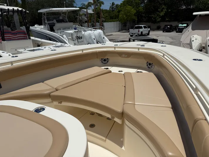  Yacht Photos Pics 2020 Scout 355 LXF boat interior with tan seating and modern design.