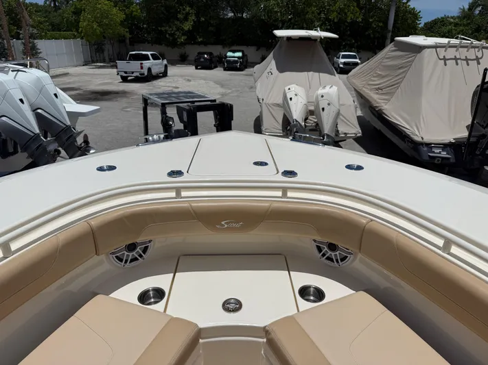  Yacht Photos Pics 2020 Scout 355 LXF boat interior with beige seating and cup holders.