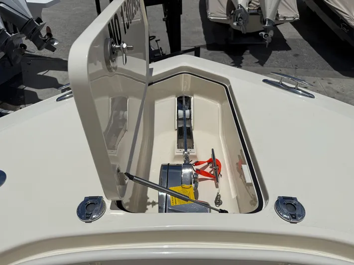  Yacht Photos Pics 2020 Scout 355 LXF boat anchor compartment with open hatch, showcasing anchor equipment.