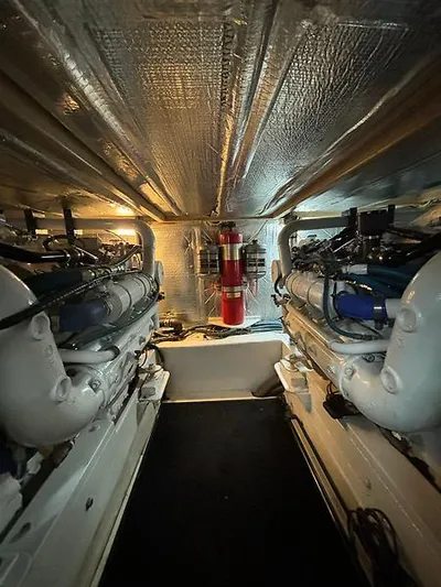  Yacht Photos Pics Engine room of 1969 Hatteras 45 Sportfish boat, featuring dual engines and fire suppression system.