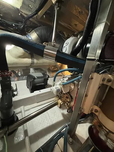  Yacht Photos Pics Engine room of 1969 Hatteras 45 Sportfish boat, showcasing mechanical components and piping.