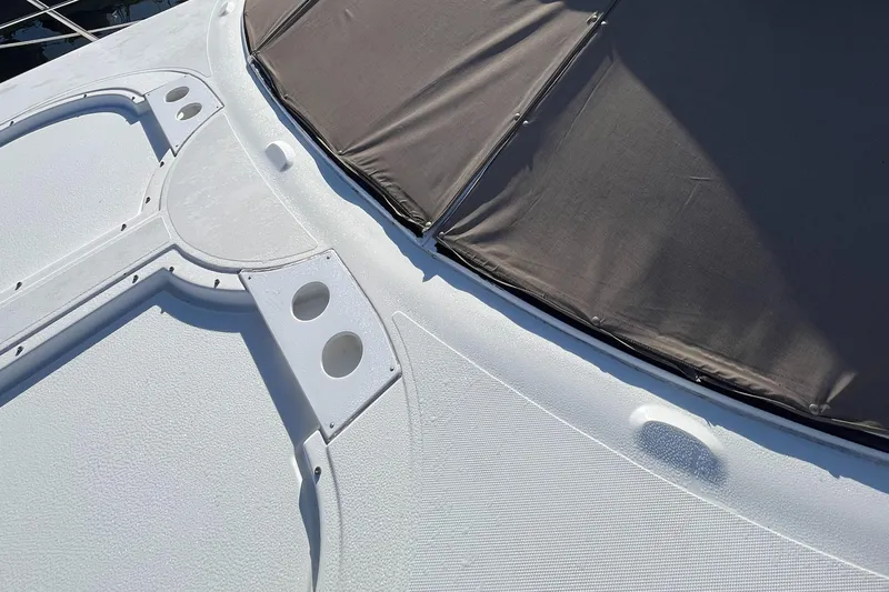 Two Can Do It Yacht Photos Pics Cruisers Yachts 4450 (2000) deck with sunshade and textured surface.
