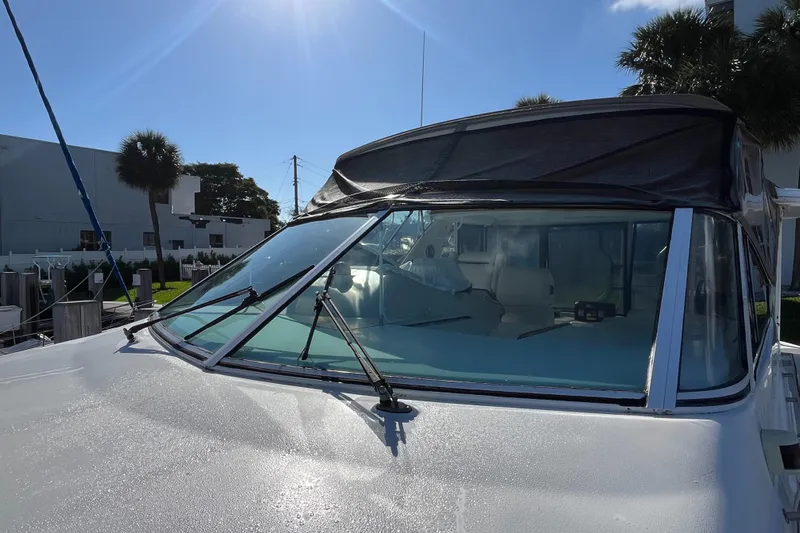 Two Can Do It Yacht Photos Pics Cruisers Yachts 4450, 2000 model, front view with windshield and canopy.