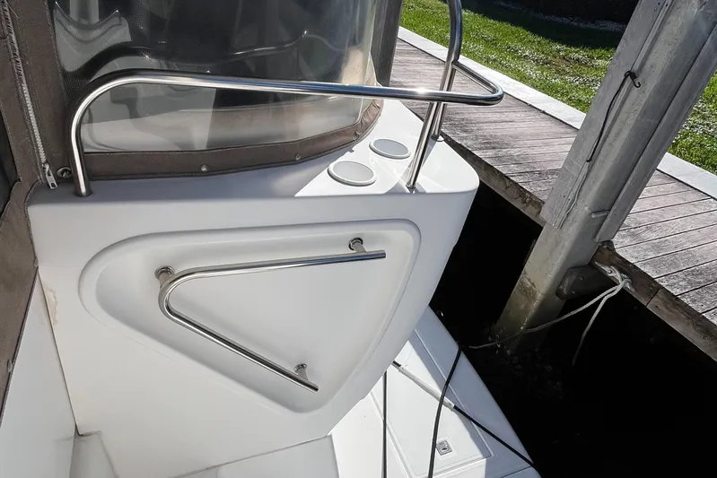 Two Can Do It Yacht Photos Pics 2000 Cruisers Yachts 4450, deck detail with railing and dock view.