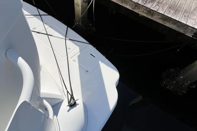 Two Can Do It Yacht Photos Pics Cruisers Yachts 4450 (2000) docked, showing deck and mooring lines.