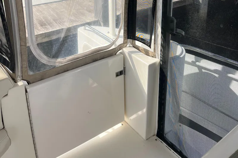 Two Can Do It Yacht Photos Pics Interior view of 2000 Cruisers Yachts 4450 with window and seating area.