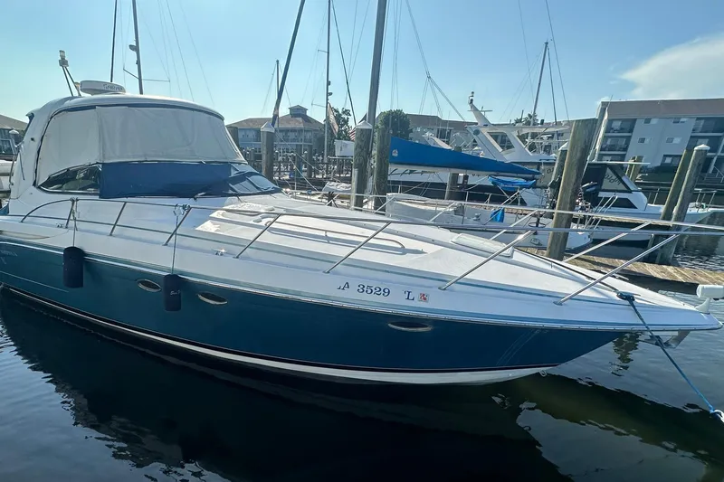 Sea Doc III Yacht Photos Pics 2005 Formula 37 PC yacht docked at marina, blue and white exterior.