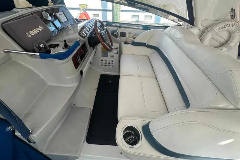 Sea Doc III Yacht Photos Pics 2005 Formula 37 PC boat interior with white seating and navigation controls.