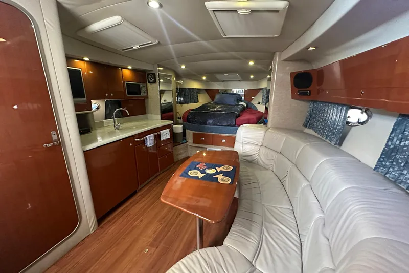 Sea Doc III Yacht Photos Pics Luxurious interior of a 2005 Formula 37 PC yacht with modern amenities and cozy seating.