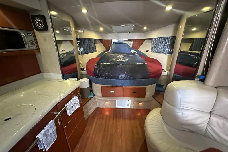 Sea Doc III Yacht Photos Pics Luxurious interior of a 2005 Formula 37 PC yacht with cozy bed and kitchenette.