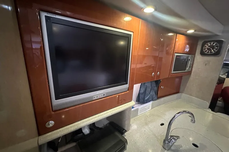Sea Doc III Yacht Photos Pics Interior of 2005 Formula 37 PC yacht with TV, microwave, and modern cabinetry.