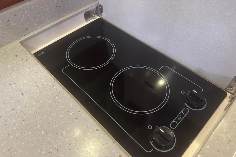 Sea Doc III Yacht Photos Pics Built-in electric stove on a 2005 Formula 37 PC yacht kitchen countertop.