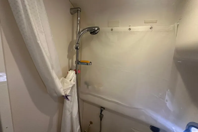 Sea Doc III Yacht Photos Pics Shower area in 2005 Formula 37 PC boat with curtain and handheld showerhead.