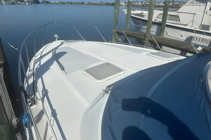 Sea Doc III Yacht Photos Pics 2005 Formula 37 PC yacht docked at marina, featuring sleek white deck design.