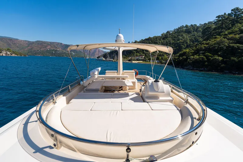 Jasmine 3 Yacht Photos Pics Luxurious 2011 Apreamare Maestro 65 yacht on serene blue waters, surrounded by lush green hills.