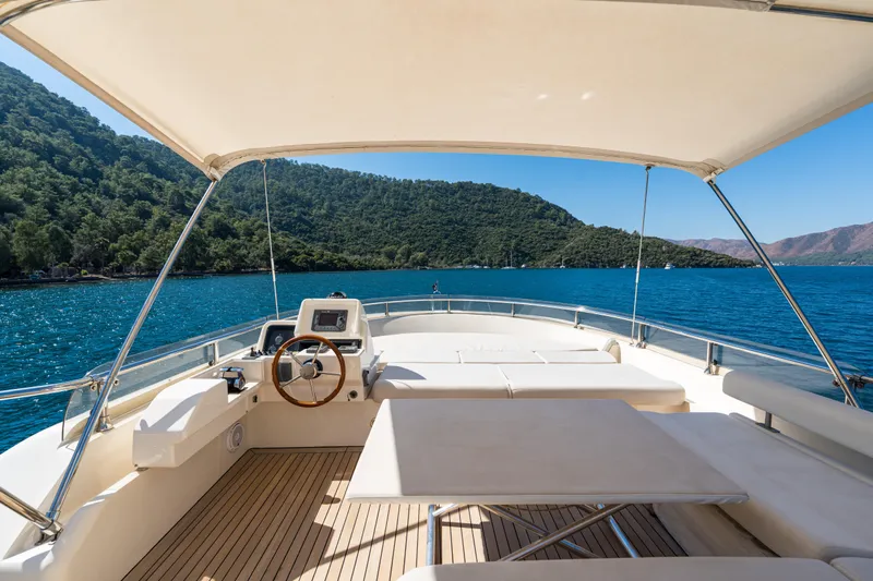 Jasmine 3 Yacht Photos Pics 2011 Apreamare Maestro 65 yacht deck with scenic ocean and mountain view.