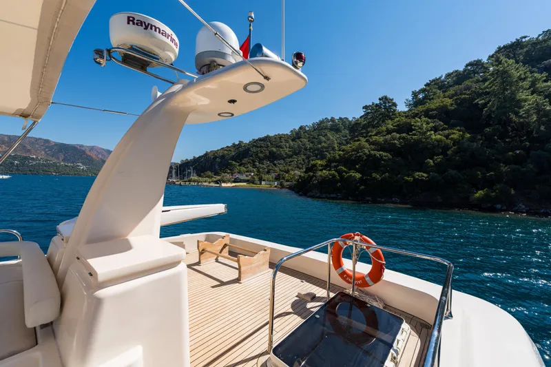 Jasmine 3 Yacht Photos Pics Luxurious 2011 Apreamare Maestro 65 yacht deck with scenic ocean and lush coastline views.