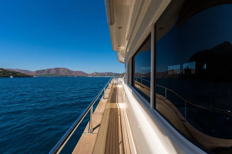 Jasmine 3 Yacht Photos Pics Side view of 2011 Apreamare Maestro 65 yacht cruising on blue waters.