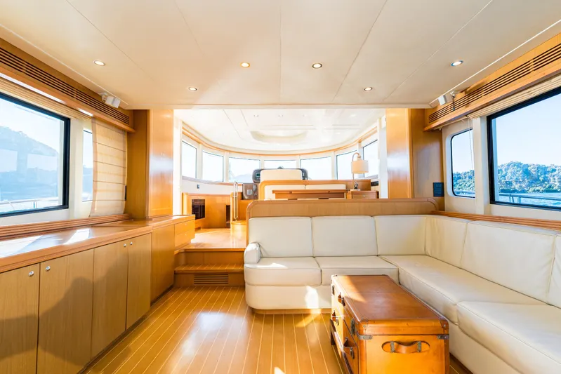 Jasmine 3 Yacht Photos Pics Luxurious interior of 2011 Apreamare Maestro 65 yacht with elegant wood finishes and panoramic windows.