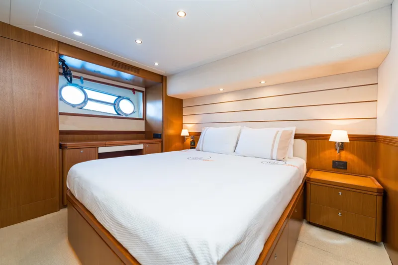 Jasmine 3 Yacht Photos Pics Luxurious cabin interior of 2011 Apreamare Maestro 65 yacht with elegant wood finishes.