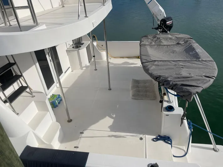 Sunset Cay Yacht Photos Pics 2004 Endeavour Explorer 46 PowerCat deck with covered equipment and water view.