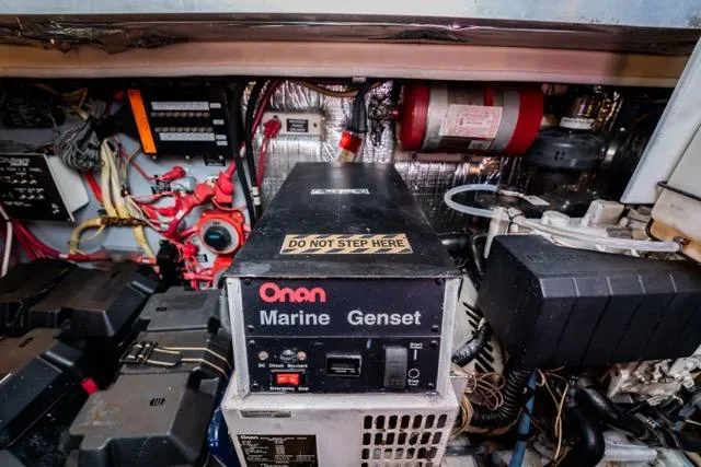 Lunasea Yacht Photos Pics Engine room of 2005 Cruiser Yachts 405 EXPRESS with Onan Marine Genset.