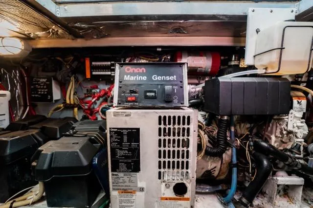 Lunasea Yacht Photos Pics Engine room of 2005 Cruiser Yachts 405 EXPRESS with Onan Marine Genset.