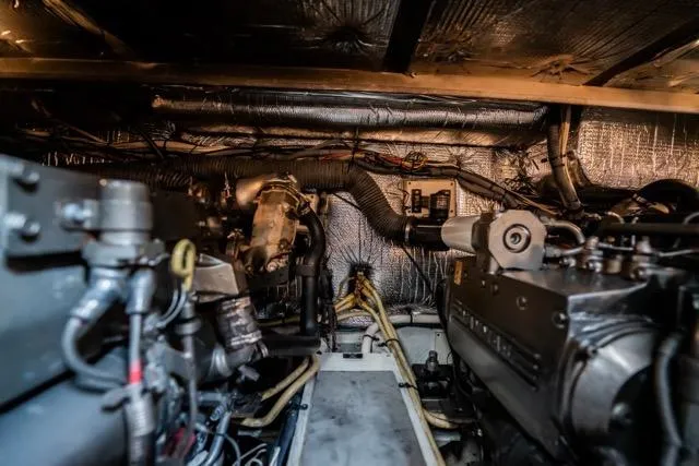 Lunasea Yacht Photos Pics Engine room of 2005 Cruiser Yachts 405 EXPRESS, showcasing mechanical components and wiring.