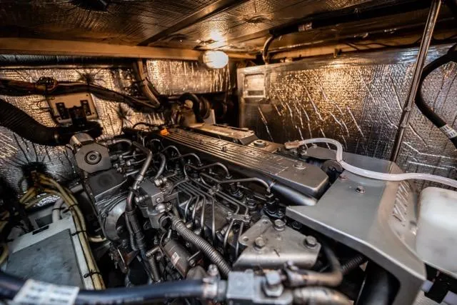 Lunasea Yacht Photos Pics Engine room of 2005 Cruiser Yachts 405 EXPRESS with metallic components and insulation.