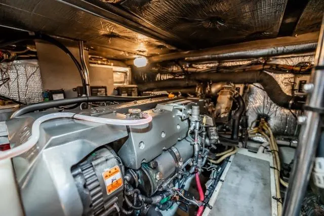 Lunasea Yacht Photos Pics Engine room of 2005 Cruiser Yachts 405 EXPRESS, showcasing mechanical components and wiring.