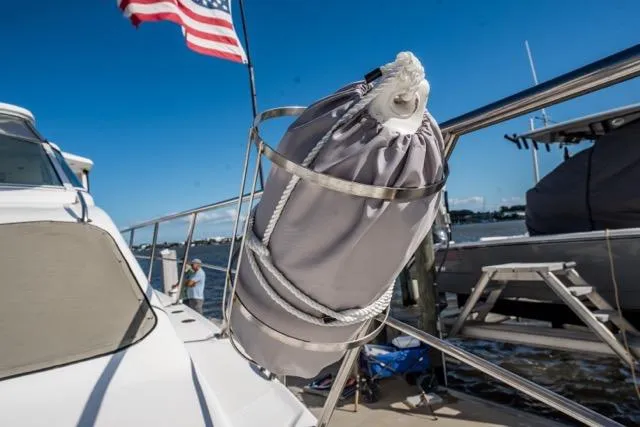 Lunasea Yacht Photos Pics 2005 Cruiser Yachts 405 EXPRESS with American flag, docked, featuring a secured fender.