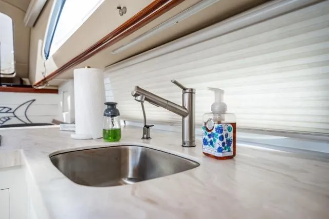 Lunasea Yacht Photos Pics Modern kitchen sink area on 2005 Cruiser Yachts 405 EXPRESS with soap dispensers.