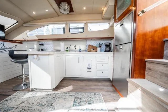 Lunasea Yacht Photos Pics Luxurious 2005 Cruiser Yachts 405 EXPRESS kitchen interior with modern amenities and stylish design.