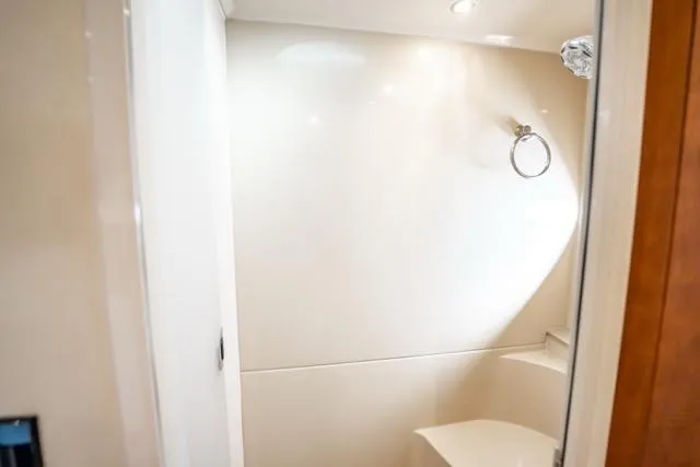 Lunasea Yacht Photos Pics Bathroom interior of 2005 Cruiser Yachts 405 EXPRESS, featuring sleek white design.