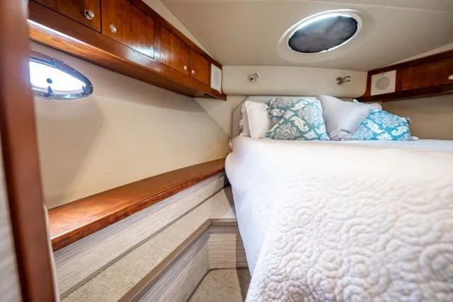 Lunasea Yacht Photos Pics Luxurious cabin interior of 2005 Cruiser Yachts 405 EXPRESS with cozy bedding and wood accents.
