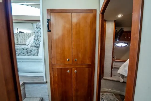 Lunasea Yacht Photos Pics 2005 Cruiser Yachts 405 EXPRESS interior with wooden cabinetry and cozy bedroom.