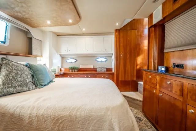 Lunasea Yacht Photos Pics Luxurious cabin interior of 2005 Cruiser Yachts 405 EXPRESS with elegant wood finishes.