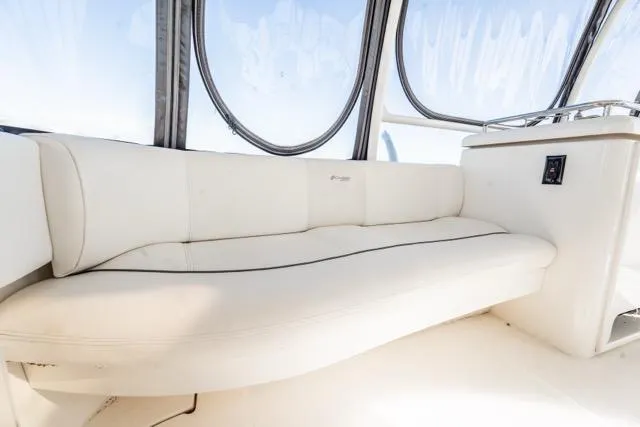 Lunasea Yacht Photos Pics Luxurious seating on 2005 Cruiser Yachts 405 EXPRESS, featuring elegant white upholstery.