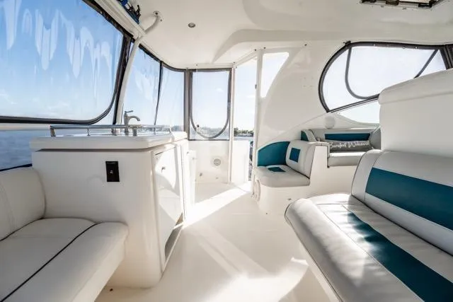 Lunasea Yacht Photos Pics Luxurious interior of 2005 Cruiser Yachts 405 EXPRESS with elegant seating and panoramic windows.