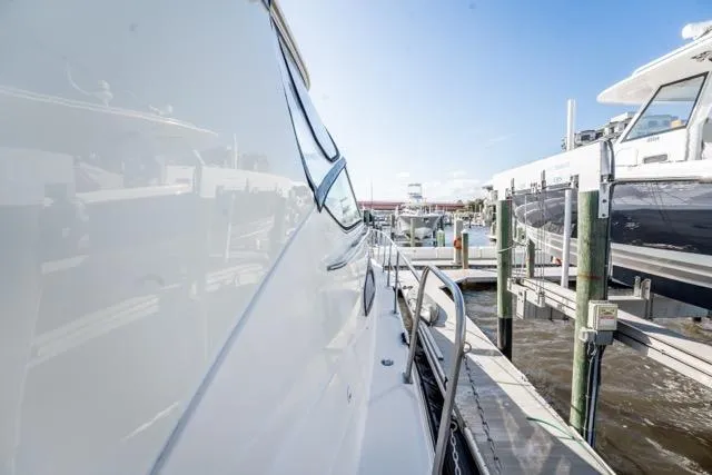 Lunasea Yacht Photos Pics 2005 Cruiser Yachts 405 EXPRESS docked at marina under clear blue sky.